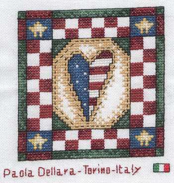 Cross-stitched memorial square by Paola Dellara