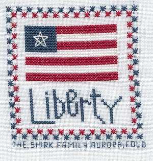 Cross-stitched memorial square by Rachel Shirk